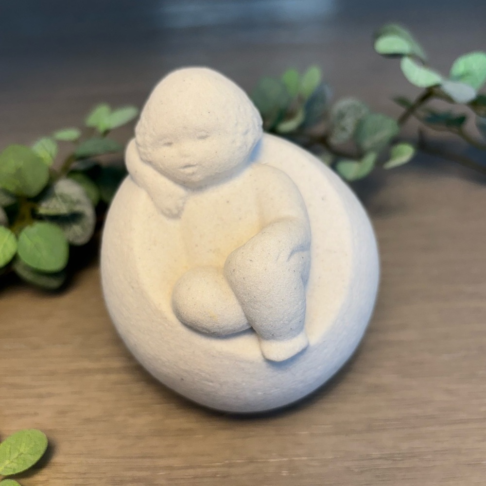 Marbell by Stone Art Belgium Charming Child sitting on a beanbag chair Figurine.